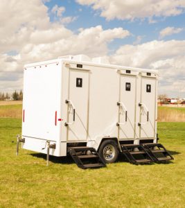 luxury porta potty trailer at an event outdoors